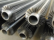 Why are cold-wound galvanized finned steel tubes commonly used in heat exchanger