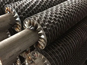 Why are stainless steel finned tubes considered a crucial component of industrial heat exchangers