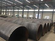 What are the causes of pinholes in the weld seam of spiral submerged arc welded steel pipes