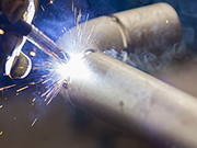 Preheating, post-heating, and post-weld heat treatment during steel pipe welding