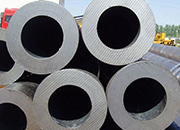 How should thick-walled steel pipes be stacked